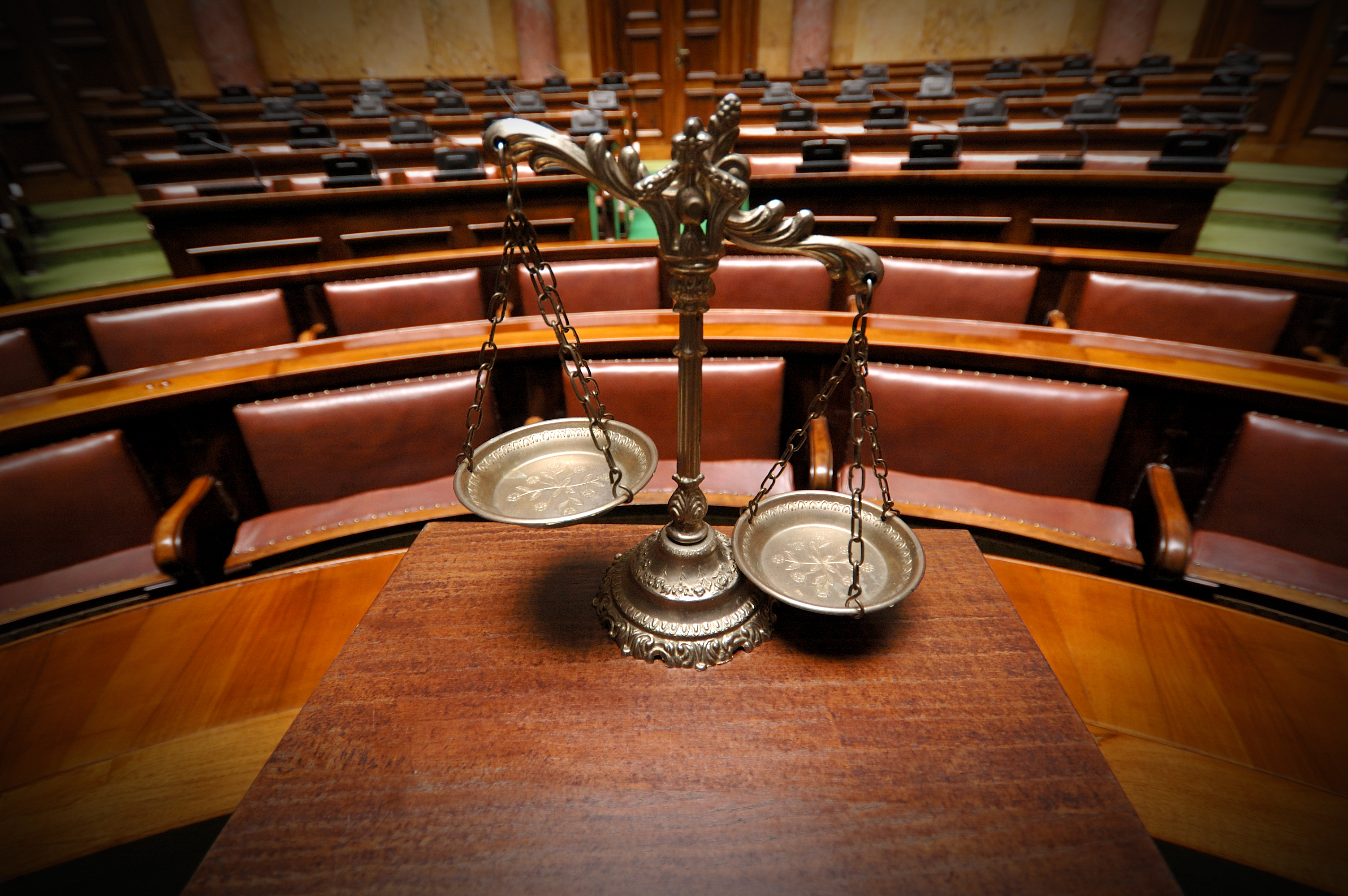 Symbol of law and justice in the empty courtroom, law and justice concept.