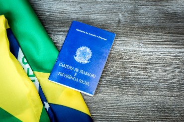 Brazilian work document and social security document on the table (Carteira de Trabalho)